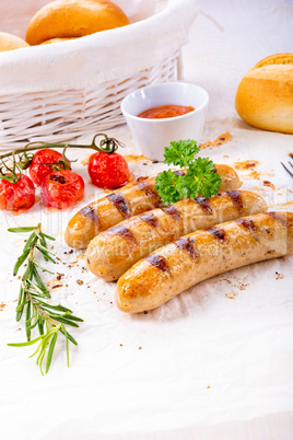 delicious bratwurst with ketchup and fresh rolls