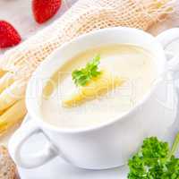 asparagus cream soup with capers and fresh baguette