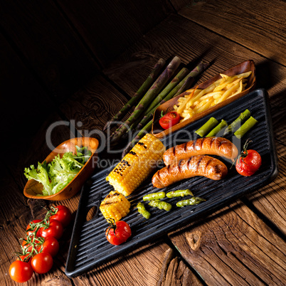 grilled krakauer with french fries and green salad