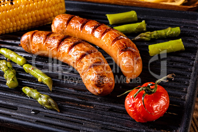 grilled krakauer with french fries and green salad