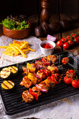 Rustic shish kebab skewers with marinated ham meat paprika and r