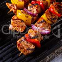 Rustic shish kebab skewers with marinated ham meat paprika and r