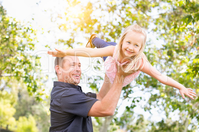 Young Caucasian Father and Daughter Having Fun At The Park