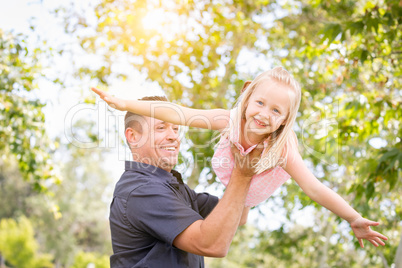 Young Caucasian Father and Daughter Having Fun At The Park