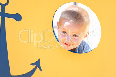 Happy Young Boy Having Fun At The Playground