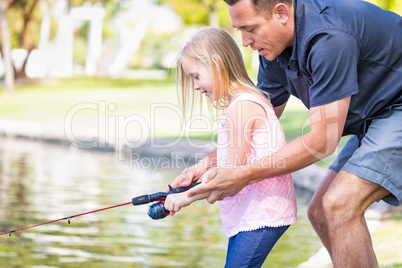 Young Caucasian Father and Daughter Having Fun Fishing At The La