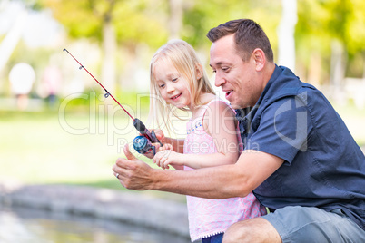 Young Caucasian Father and Daughter Having Fun Fishing At The La