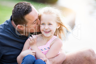 Young Caucasian Father and Daughter Having Fun At The Park