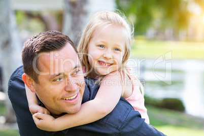 Young Caucasian Father and Daughter Having Fun At The Park