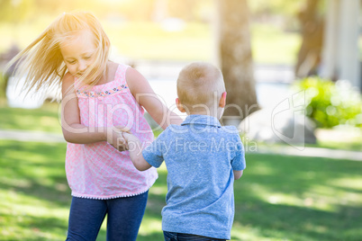 Young Brother and Sister Playing At The Park Togther