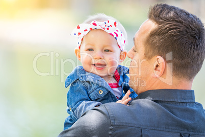 Young Caucasian Father and Baby Girl At The Park