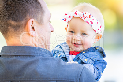 Young Caucasian Father and Baby Girl At The Park