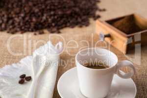 Coffee with coffee-beans on jute