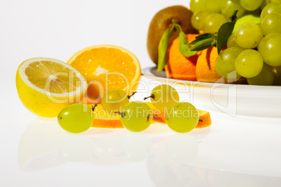 Sliced fruits and plate