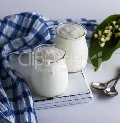 two glass jars with homemade yogurt