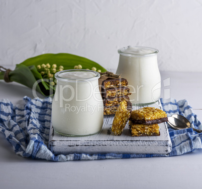 homemade yogurt in a glass jar and snacks