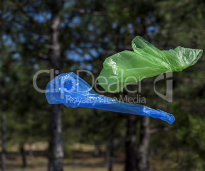 Two polyethylene bags for garbage fly in the air