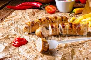 rustic bratwurst with pommes and hot ketchup