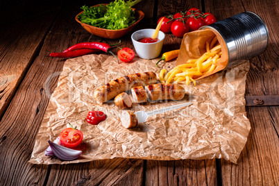 rustic bratwurst with pommes and hot ketchup