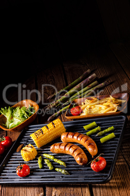 grilled krakauer with french fries and green salad