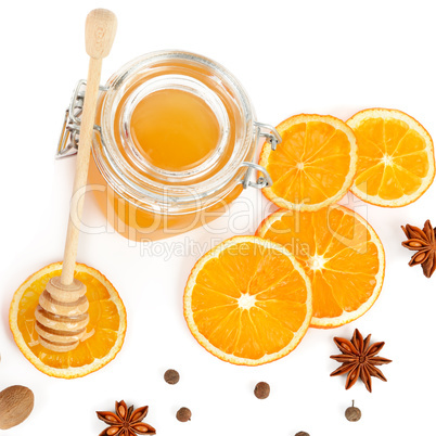 Honey and orange slices isolated on white background. Flat lay,