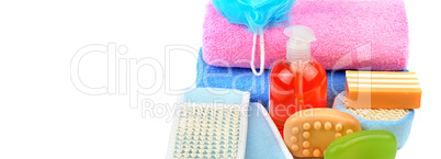 Cotton towels, cosmetic soap, sponge and shampoo isolated on whi