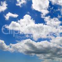 Cumulus clouds in the blue sky.