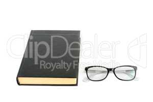 Book and glasses isolated on white background. Free space for te