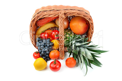 Vegetables and fruits in a basket isolated on white background.