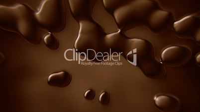 Falling hot chocolate drops in slow motion