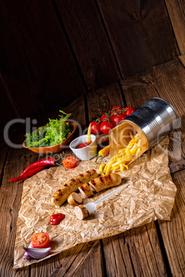 rustic bratwurst with pommes and hot ketchup