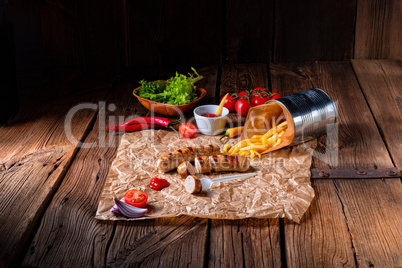 rustic bratwurst with pommes and hot ketchup