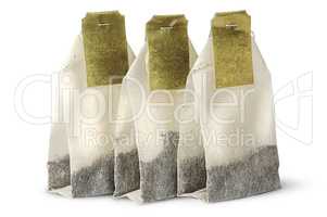 Three tea bags with labels