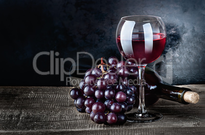 Wine with grapes and bottle
