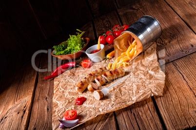 rustic bratwurst with pommes and hot ketchup