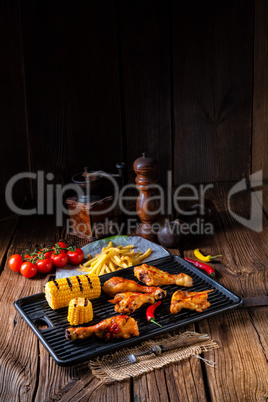 Rustic Grilled chicken wings,legs,and spicy corn