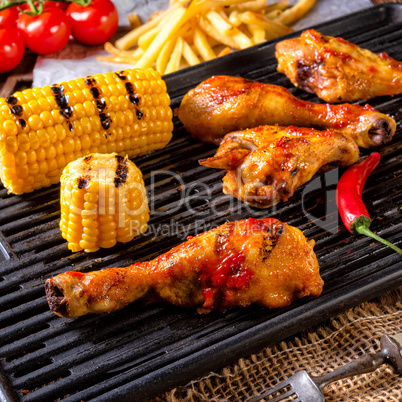 Rustic Grilled chicken wings,legs,and spicy corn