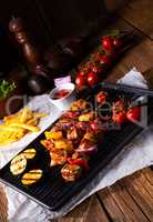 Rustic shish kebab skewers with marinated ham meat paprika and r