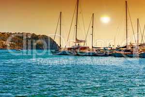 Sunset over a mediterranean bay with marina