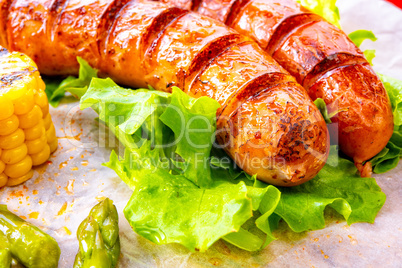 grilled krakauer sausage with boiled corn and green salad