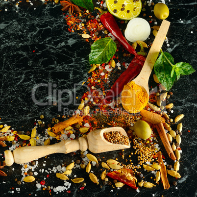 Variety of spices and herb on kitchen table.