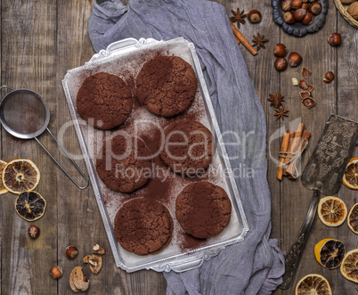 baked round chocolate chip cookies on a silver plate