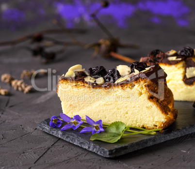 piece of cheesecake on a black background