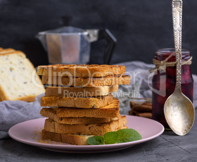 a stack of fried square slices of bread