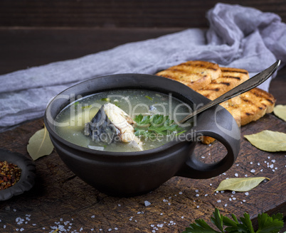 fish soup of mackerel in a brown clay plate