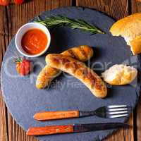 rustic bratwurst with ketchup and fresh rolls