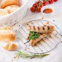 delicious bratwurst with ketchup and fresh rolls