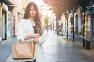 Beautiful woman buying in comercial street