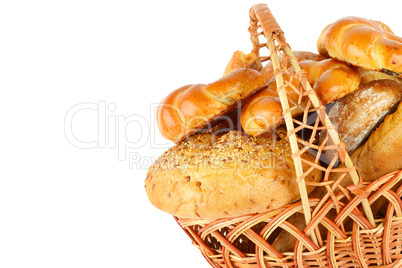 Sweet pastries, bread and flour products in a wicker basket isol
