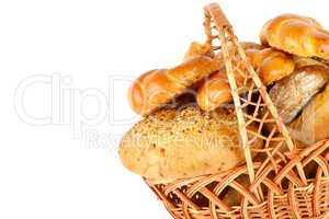 Sweet pastries, bread and flour products in a wicker basket isol